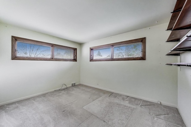 621 N Hamlin Ave, Park Ridge, IL 60068 - spare room featuring baseboards, light carpet, and visible vents