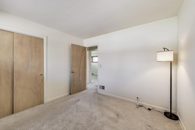 621 N Hamlin Ave, Park Ridge, IL 60068 - unfurnished bedroom with visible vents, carpet flooring, baseboards, and a closet