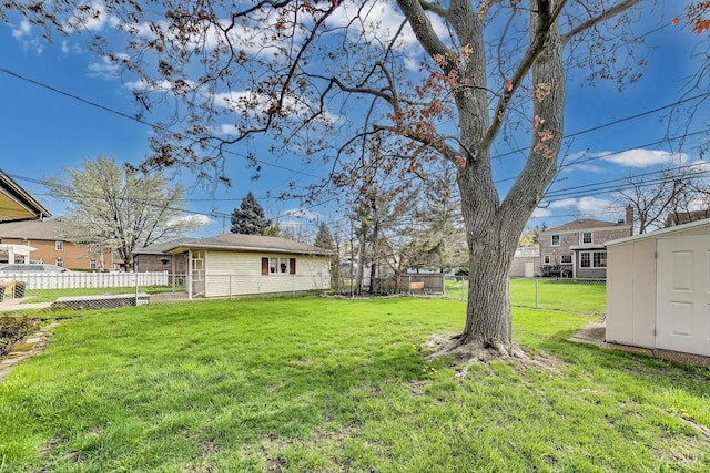 621 N Hamlin Ave, Park Ridge, IL 60068 - view of yard featuring fence, an outbuilding, and a storage shed
