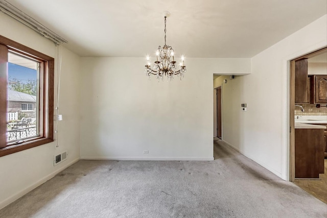 621 N Hamlin Ave, Park Ridge, IL 60068 - unfurnished dining area featuring baseboards, light colored carpet, a chandelier, and visible vents