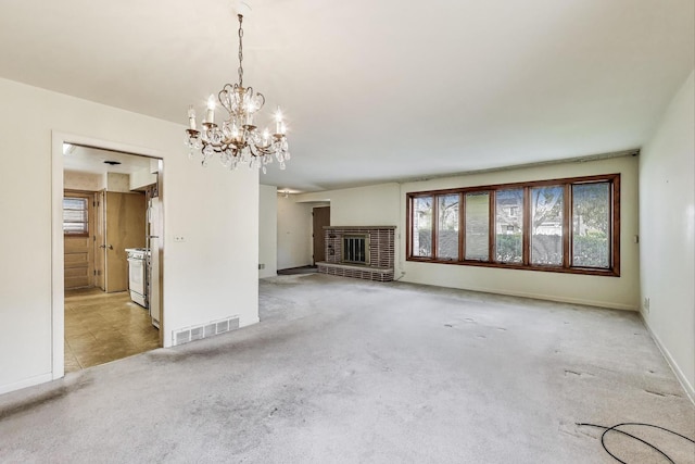 621 N Hamlin Ave, Park Ridge, IL 60068 - unfurnished living room featuring visible vents, a brick fireplace, light carpet, baseboards, and a chandelier
