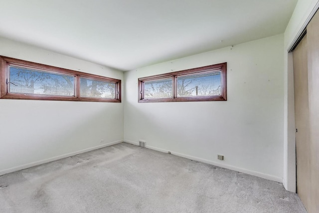 621 N Hamlin Ave, Park Ridge, IL 60068 - unfurnished bedroom with baseboards, visible vents, a closet, and light colored carpet