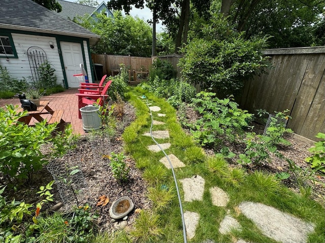 fenced backyard featuring a patio area