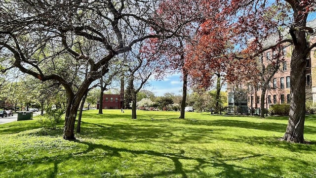 surrounding community with a yard