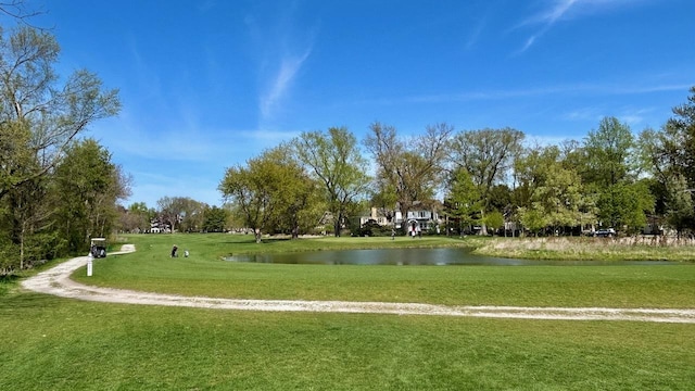 view of home's community featuring a water view and a yard