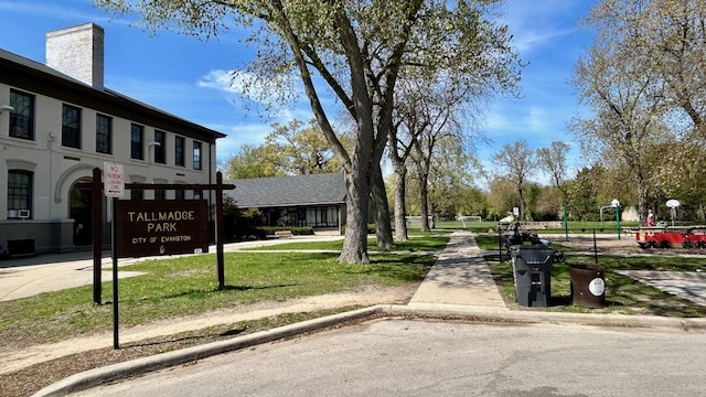 view of asphalt street featuring sidewalks and curbs