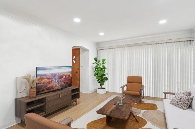 5058 S Ridgeway Ave, Chicago, IL 60632 - living area with light wood-style floors, arched walkways, baseboards, and recessed lighting