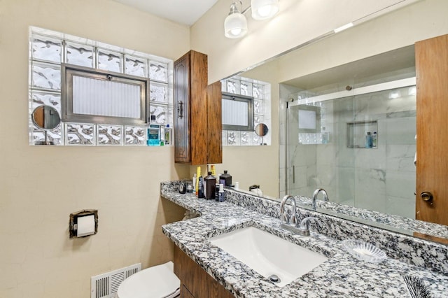 5058 S Ridgeway Ave, Chicago, IL 60632 - full bathroom with toilet, visible vents, a shower stall, and vanity