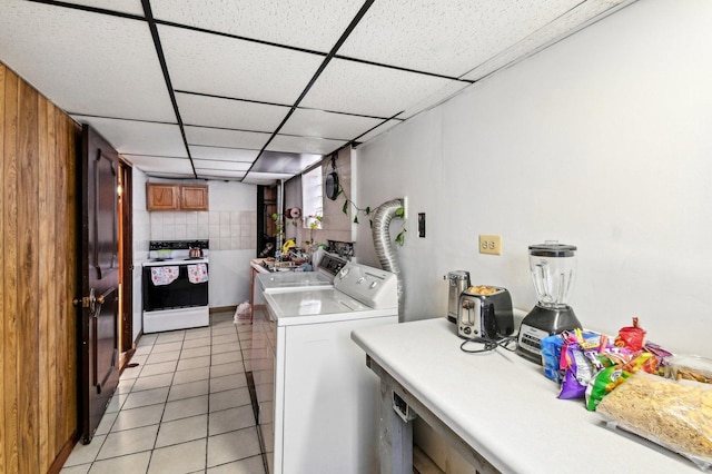5058 S Ridgeway Ave, Chicago, IL 60632 - washroom featuring laundry area, light tile patterned flooring, and washer and clothes dryer