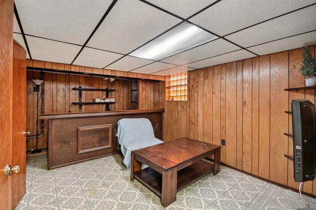 5058 S Ridgeway Ave, Chicago, IL 60632 - sitting room with wood walls and a paneled ceiling