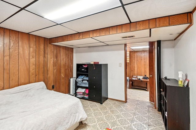 5058 S Ridgeway Ave, Chicago, IL 60632 - bedroom featuring baseboards, wood walls, visible vents, and a paneled ceiling