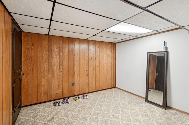 5058 S Ridgeway Ave, Chicago, IL 60632 - unfurnished room with baseboards, a drop ceiling, and wood walls