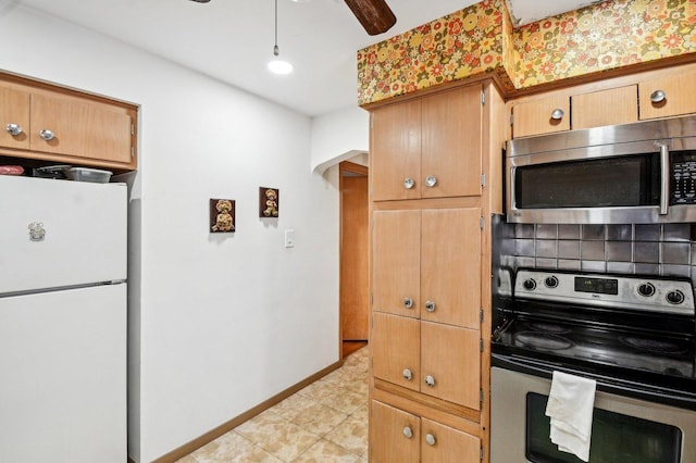 5058 S Ridgeway Ave, Chicago, IL 60632 - kitchen featuring light tile patterned flooring, ceiling fan, stainless steel appliances, baseboards, and decorative backsplash