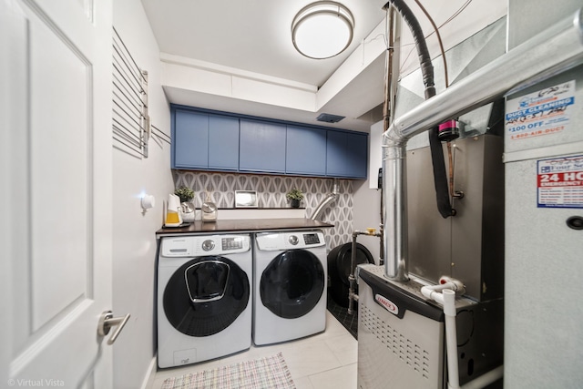 2305 Olde Mill Rd Unit 2305, Plainfield, IL 60586 - washroom featuring tile patterned flooring, cabinet space, and independent washer and dryer