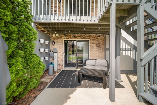 2305 Olde Mill Rd Unit 2305, Plainfield, IL 60586 - doorway to property featuring brick siding, a patio area, and a balcony