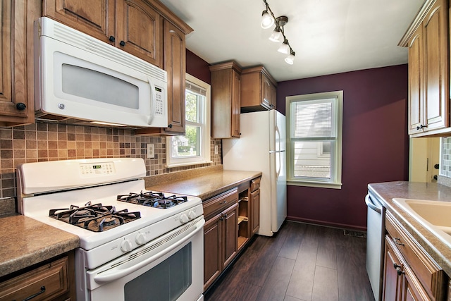 566 N 10th Ave, Kankakee, IL 60901 - kitchen featuring white appliances, decorative backsplash, and plenty of natural light
