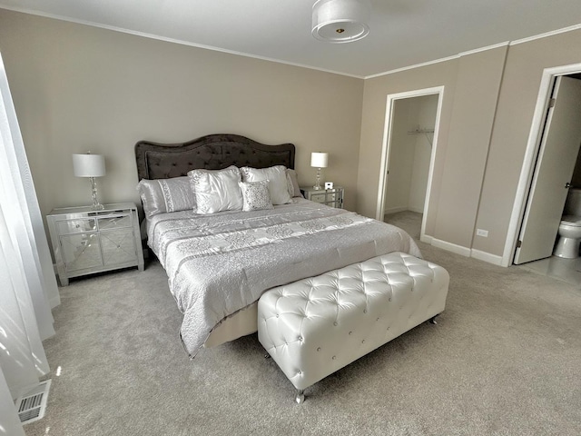 bedroom with light colored carpet, a walk in closet, visible vents, ornamental molding, and a closet