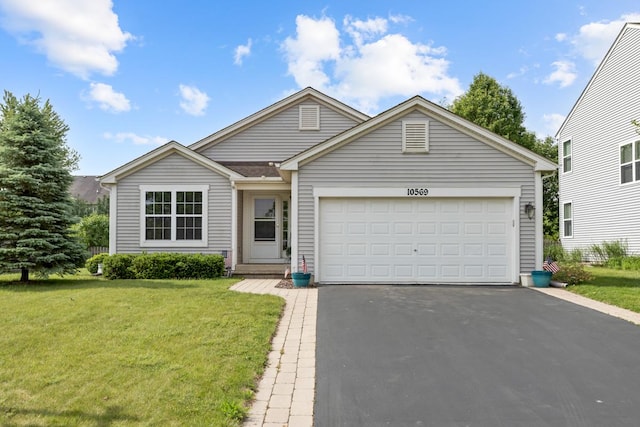 10569 Lansdale St, Huntley, IL 60142 - view of front facade featuring asphalt driveway, a front yard, and a garage