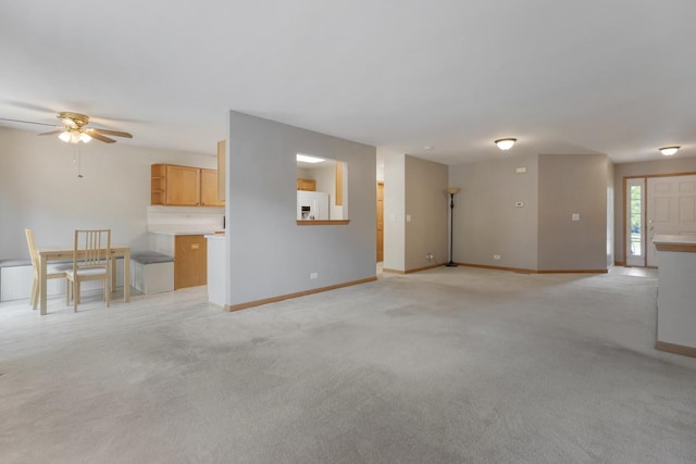 10569 Lansdale St, Huntley, IL 60142 - unfurnished living room featuring a ceiling fan and light carpet