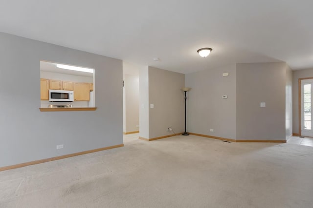 10569 Lansdale St, Huntley, IL 60142 - unfurnished room featuring baseboards and light carpet
