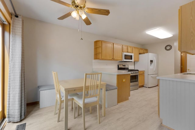 10569 Lansdale St, Huntley, IL 60142 - kitchen with white appliances, a peninsula, a ceiling fan, open shelves, and light countertops