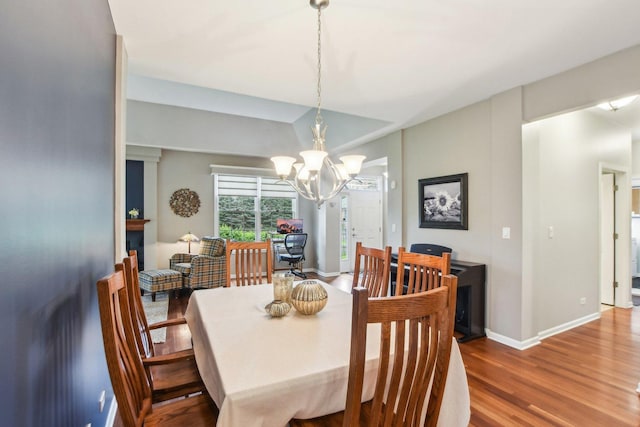 1565 Ashbury Pl, Lemont, IL 60439 - dining space featuring baseboards, a notable chandelier, and wood finished floors