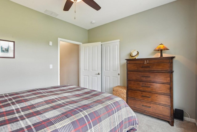 1565 Ashbury Pl, Lemont, IL 60439 - bedroom featuring visible vents, ceiling fan, a closet, and light carpet