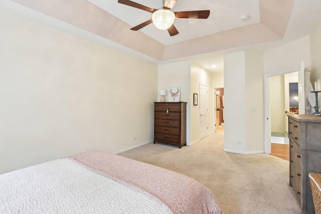 1565 Ashbury Pl, Lemont, IL 60439 - bedroom with baseboards, ensuite bathroom, a tray ceiling, and light carpet