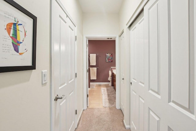 1565 Ashbury Pl, Lemont, IL 60439 - hall featuring baseboards, light carpet, and light tile patterned flooring