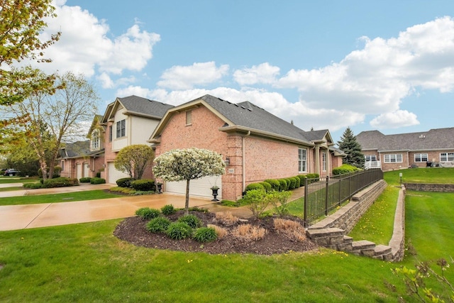 1565 Ashbury Pl, Lemont, IL 60439 - view of property exterior with an attached garage, fence, brick siding, a lawn, and driveway