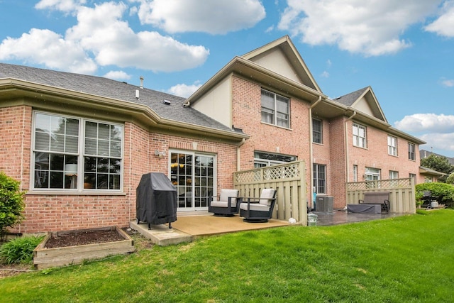 1565 Ashbury Pl, Lemont, IL 60439 - back of property featuring a lawn, a patio area, and brick siding