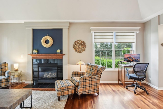 1565 Ashbury Pl, Lemont, IL 60439 - living area featuring baseboards, wood finished floors, and a tile fireplace