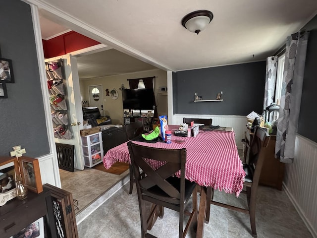 dining area featuring wainscoting