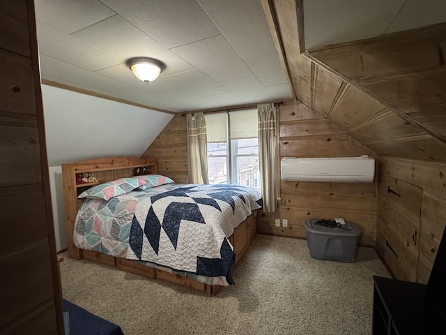 bedroom featuring a wall mounted AC, carpet flooring, wood walls, and lofted ceiling