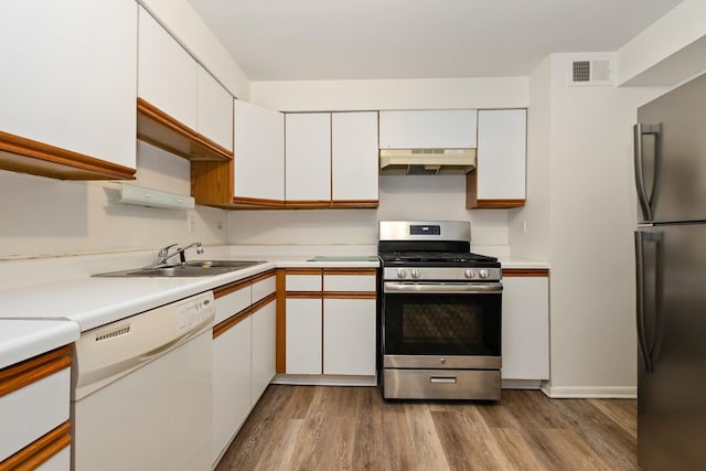 11123 S 84th Ave Unit 2B, Palos Hills, IL 60465 - kitchen with visible vents, freestanding refrigerator, stainless steel range with gas cooktop, under cabinet range hood, and dishwasher