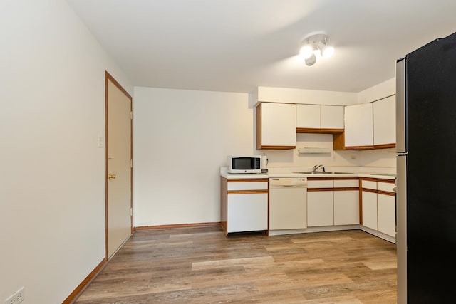 11123 S 84th Ave Unit 2B, Palos Hills, IL 60465 - kitchen with white appliances, baseboards, light wood-style flooring, and light countertops