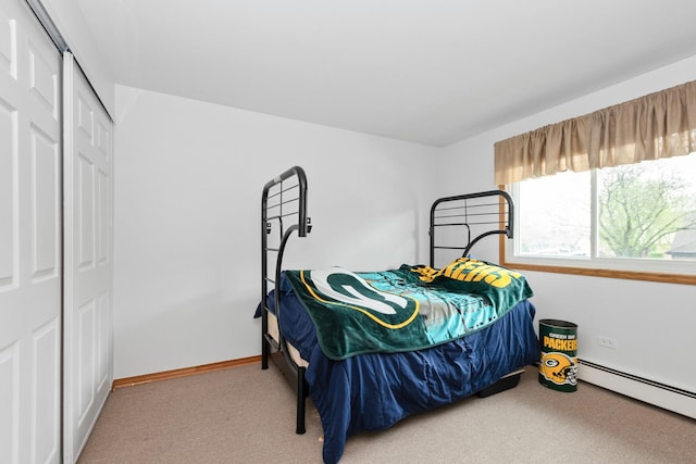 11123 S 84th Ave Unit 2B, Palos Hills, IL 60465 - bedroom with carpet flooring, a closet, and a baseboard radiator
