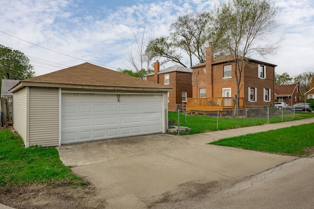 detached garage featuring fence