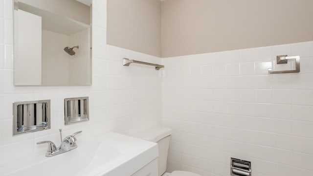 10630 W Cermak Rd Unit 2E, Westchester, IL 60154 - bathroom with a sink, tile walls, toilet, and a shower