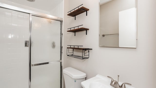 10630 W Cermak Rd Unit 2E, Westchester, IL 60154 - bathroom featuring a sink, a stall shower, and toilet