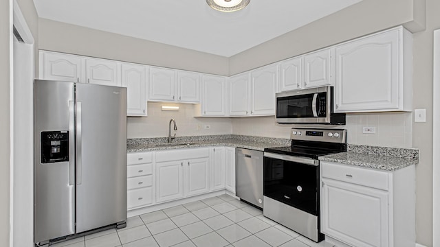 10630 W Cermak Rd Unit 2E, Westchester, IL 60154 - kitchen featuring a sink, light stone counters, backsplash, and stainless steel appliances