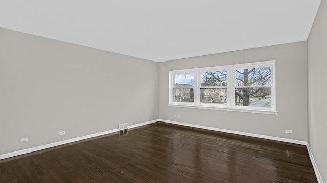 10630 W Cermak Rd Unit 2E, Westchester, IL 60154 - unfurnished room featuring baseboards, dark wood-style floors, and visible vents