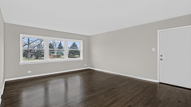 10630 W Cermak Rd Unit 2E, Westchester, IL 60154 - empty room featuring dark wood-type flooring and baseboards