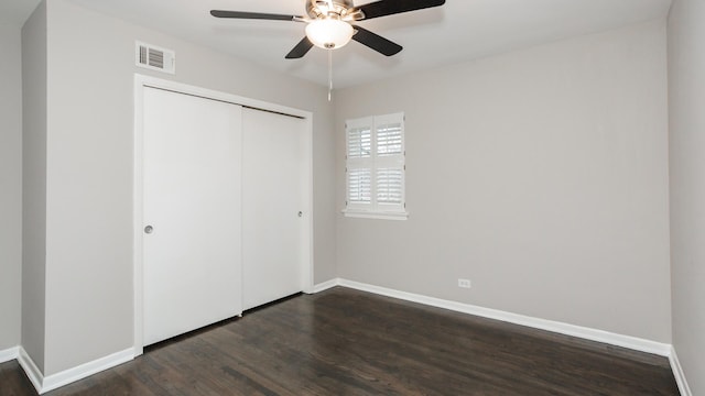 10630 W Cermak Rd Unit 2E, Westchester, IL 60154 - unfurnished bedroom featuring visible vents, dark wood finished floors, baseboards, and a closet