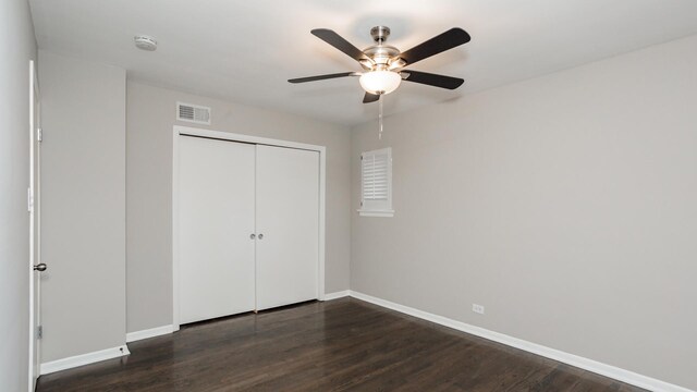 10630 W Cermak Rd Unit 2E, Westchester, IL 60154 - unfurnished bedroom with visible vents, a closet, dark wood-style flooring, baseboards, and ceiling fan