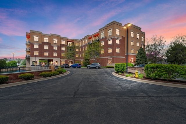 view of property with uncovered parking