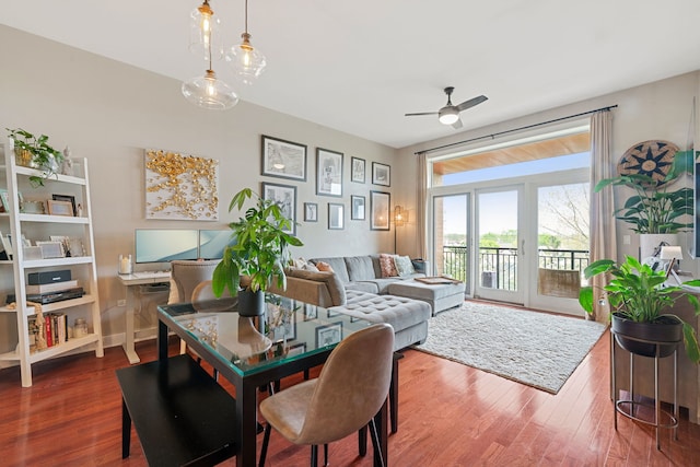 dining room with ceiling fan and wood finished floors