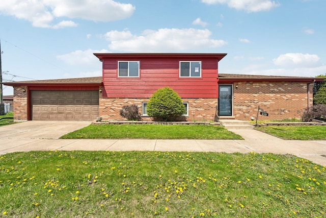 310 Muskegon Ave, Calumet City, IL 60409 - tri-level home with brick siding, an attached garage, a front yard, and concrete driveway