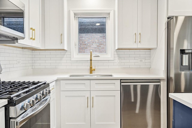 310 Muskegon Ave, Calumet City, IL 60409 - kitchen with white cabinets, stainless steel appliances, a sink, and light countertops