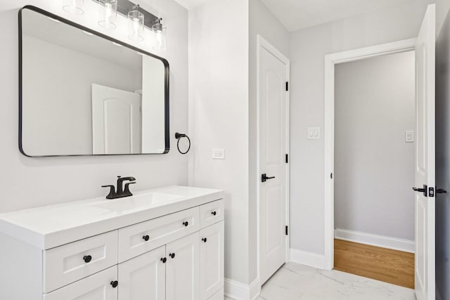 310 Muskegon Ave, Calumet City, IL 60409 - bathroom with baseboards, marble finish floor, and vanity